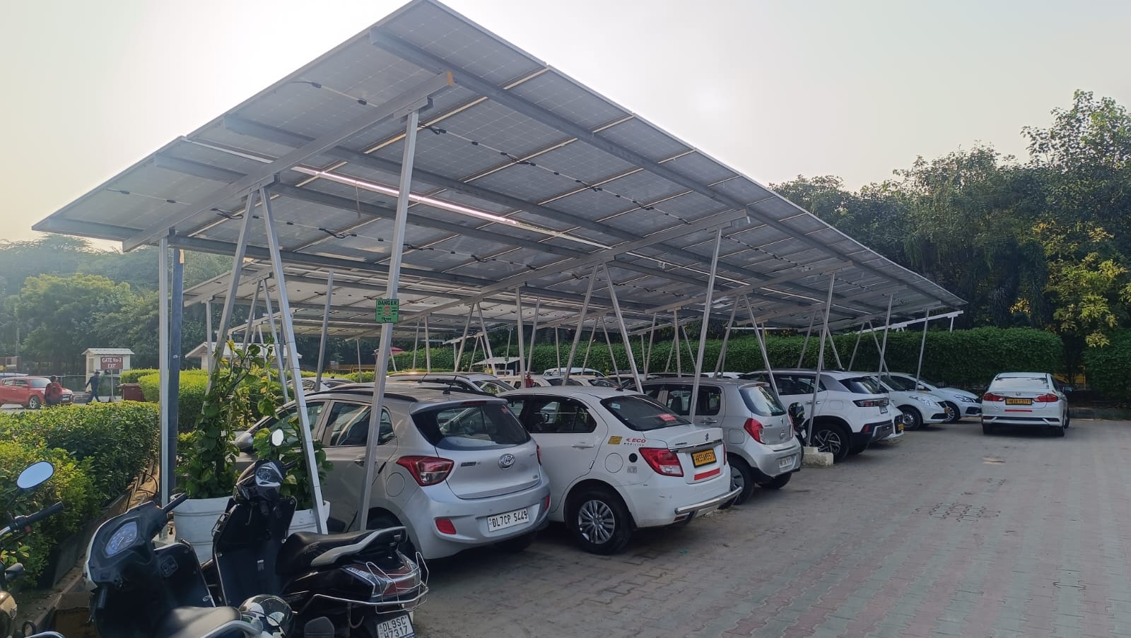 A solar carport is an innovative structure that combines the practicality of a covered parking space with the efficiency of solar energy production. This eco-friendly solution supports solar panels on its roof, which generate electricity while providing protection for vehicles underneath.